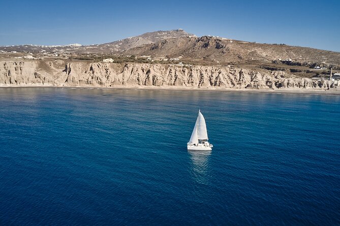 Santorini: Caldera Private Catamaran Cruise with Meal & Drinks - Choosing between a daytime and sunset departure