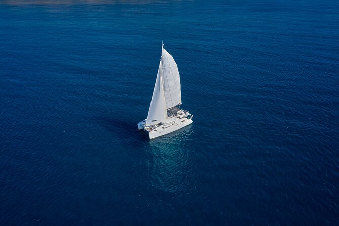 Santorini: Caldera Private Catamaran Cruise with Meal & Drinks - White Beach and the value of seeing it by boat
