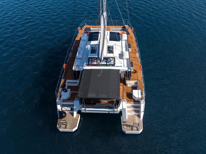 Santorini: Catamaran Caldera Cruise with Meal and Drinks - Sailing past Aspronisi and the southern coast