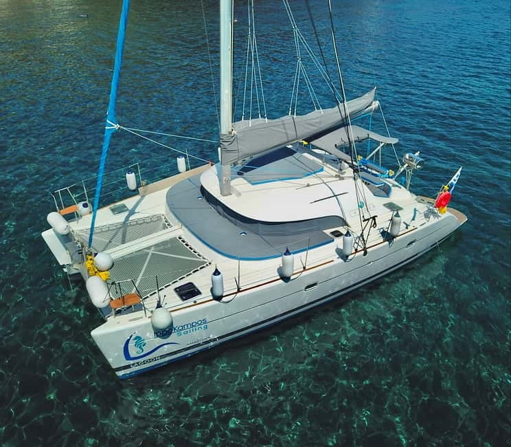 Santorini: Catamaran Cruise with Food and Drinks - Red Beach gives the cruise its first big view