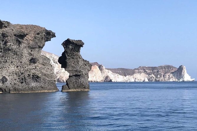 Santorini Catamaran Cruise with Greek Meal, Open-Bar and Sunset - The longer luxury route under Oia