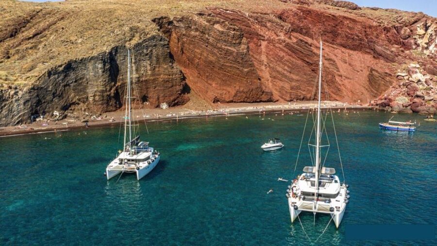 Santorini: Catamaran Cruise with Lunch, Drinks, & Oia Visit - The sunset finish at Vlychada