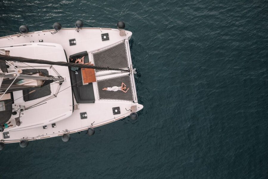Santorini Catamaran Cruise with Swimming, Meal and Open Bar - Red Beach and White Beach from the water