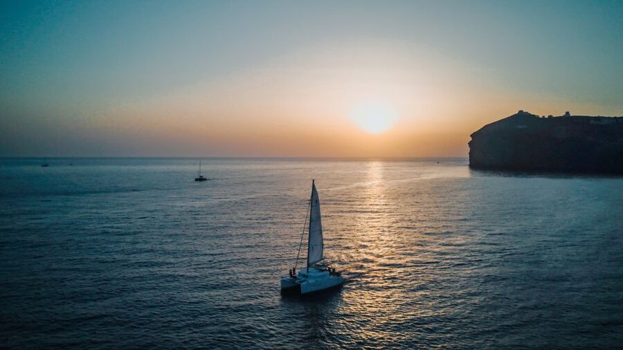 Santorini Catamaran Cruise with Swimming, Meal and Open Bar - The return sail through Black Mountain and Indian Rock