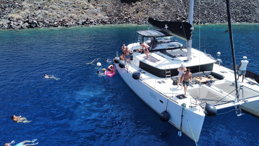 Santorini Catamaran Cruise with Swimming, Meal and Open Bar - Pickup from Thera or Oia, then the ride to Vlychada