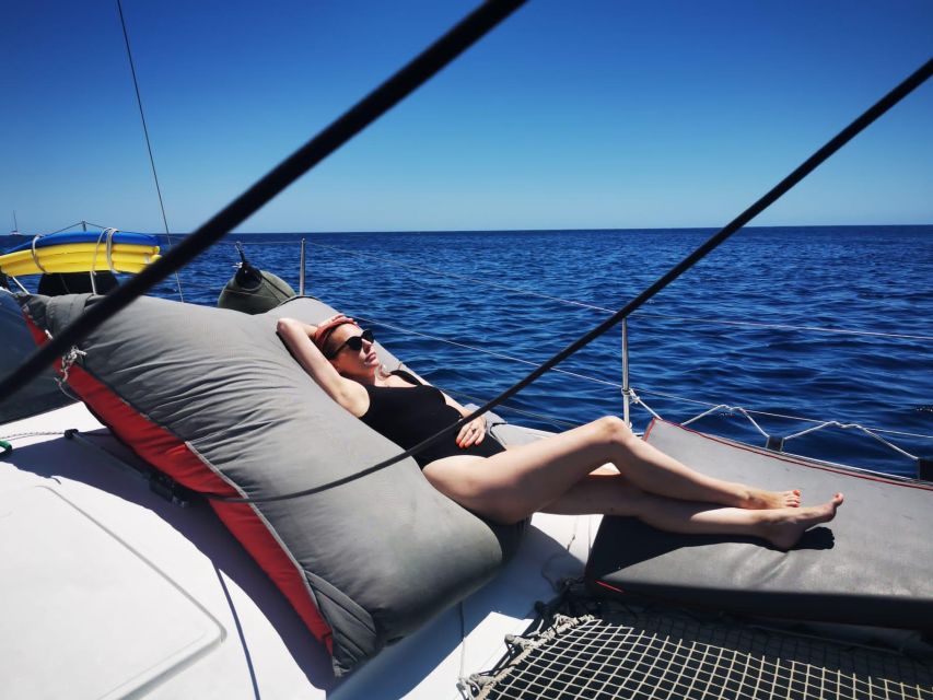 Santorini:Catamaran: private cruise with food & drinks - Why seeing Santorini from the sea matters