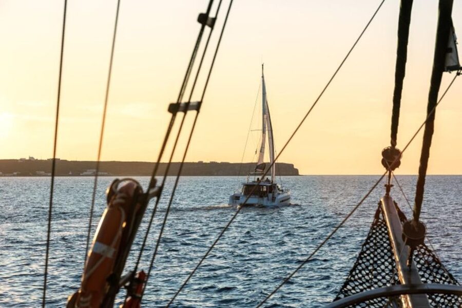 Santorini Catamaran Sunset Skyline Cruise - Red Beach and the first swim