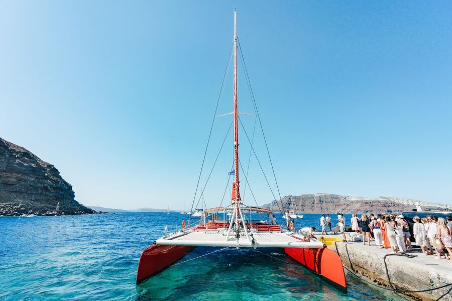 Santorini: Catamaran Tour with BBQ Dinner, Drinks, and Music - The hot springs and volcanic waters