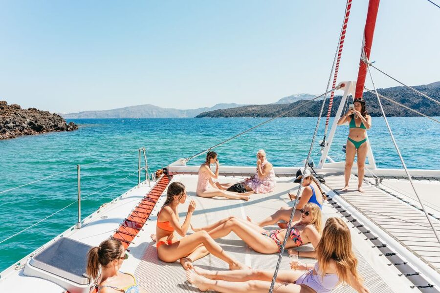 Santorini: Catamaran Tour with BBQ Dinner, Drinks, and Music - Swimming near Red Beach