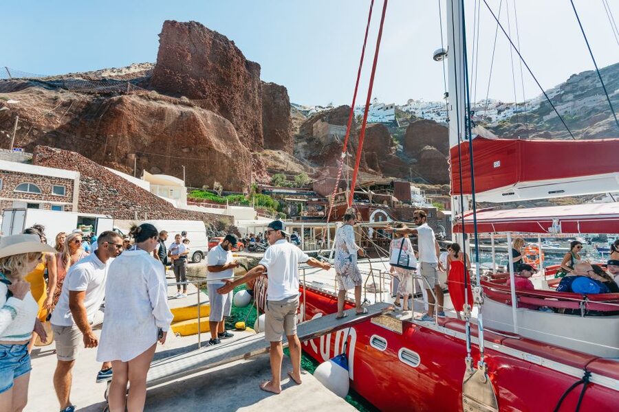 Santorini: Catamaran Tour with BBQ Dinner, Drinks, and Music - A Greek barbecue served at sea