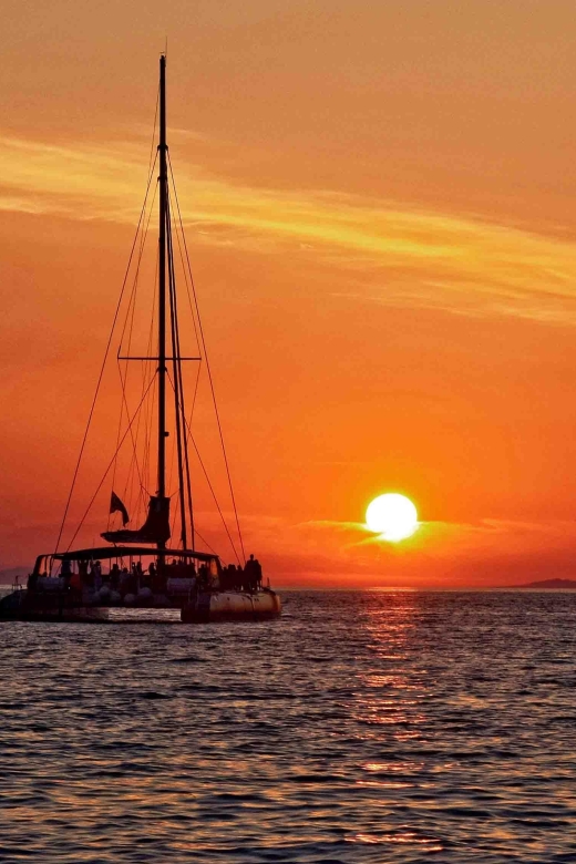 Santorini: Cruise Catamaran with BBQ & Drinks Day or Sunset - White Beach and the onboard Greek BBQ