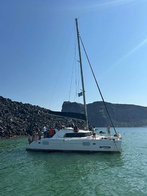 Santorini:Cruises with Catamaran around the Volcanic Island. - The onboard meal is a real part of the experience