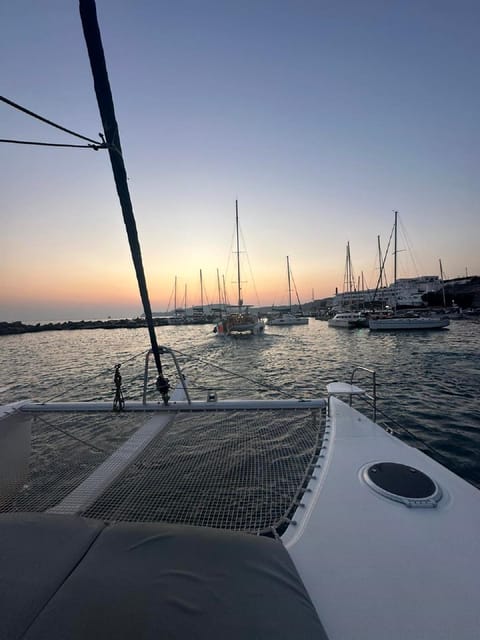 Santorini:Cruises with Catamaran around the Volcanic Island. - Daylight or sunset changes the whole mood