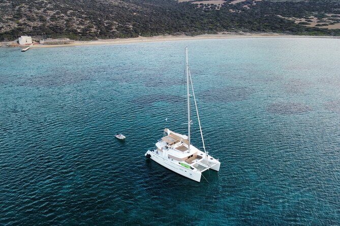 Santorini Gold Catamaran Cruise with BBQ, Drinks and Hotel Pickup - Daytime swimming or a sunset return
