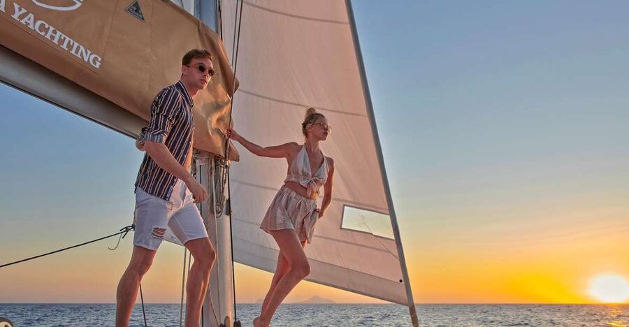 Santorini Gold Catamaran Cruise with Snorkel, BBQ & Open Bar - White Beach, the lighthouse, and volcanic scenery