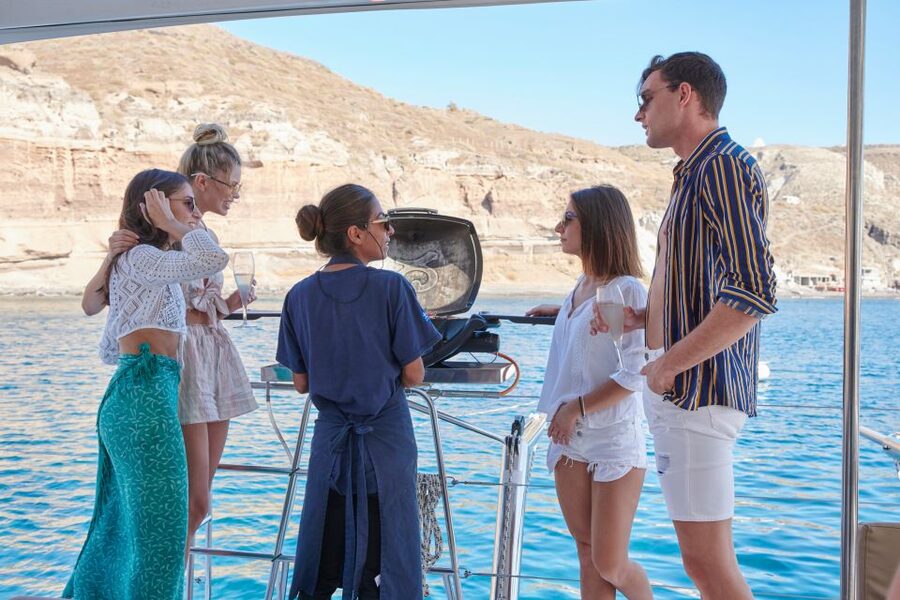 Santorini Gold Catamaran Cruise with Snorkel, BBQ & Open Bar - Mesa Pigadia and the onboard BBQ