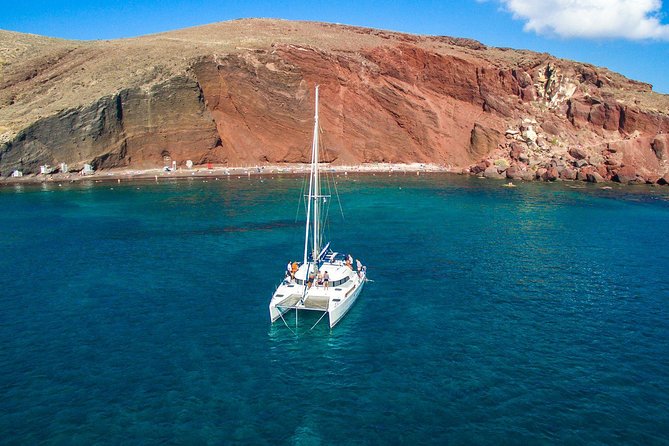 Santorini Half Day Catamaran Private Cruise incl. Meal, Drinks & Free Transport - Sailing from Vlychada, Santorini’s working south coast