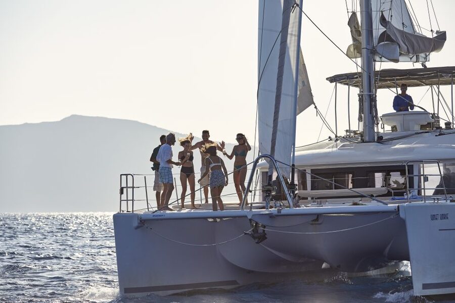 Santorini: Luxurious Catamaran Cruise with Meal & Open Bar - What the luxury catamaran delivers