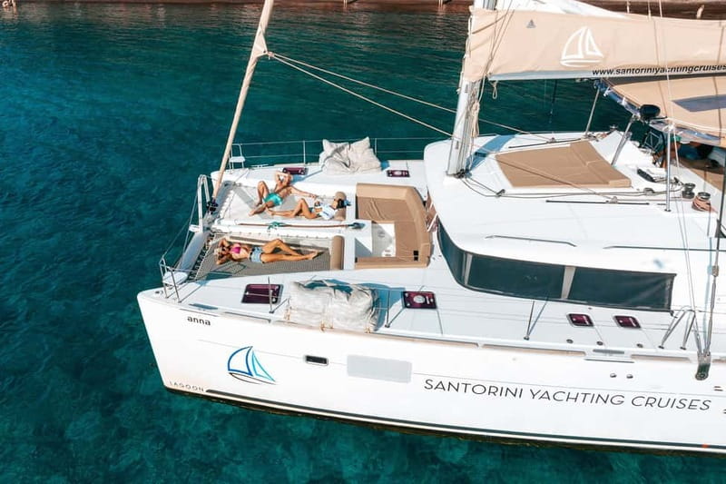 Santorini: Luxury Catamaran Cruise with Lunch, BBQ & Drinks - Sailing past Red Beach and White Beach