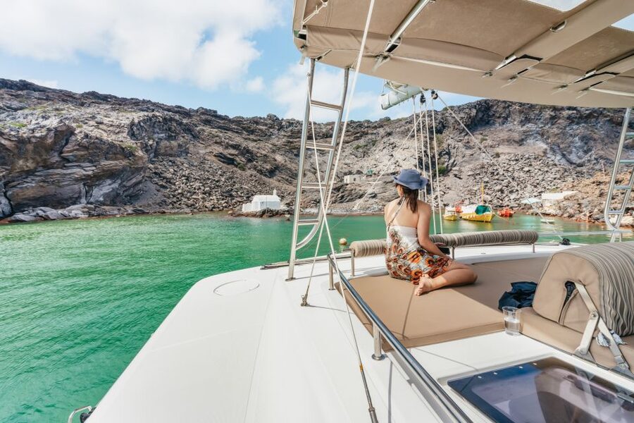 Santorini: Luxury Catamaran Day Trip with Meal and Open Bar - White Beach caves and time in the water