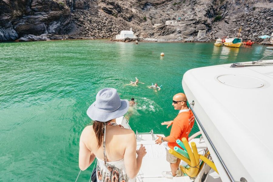 Santorini: Luxury Catamaran Day Trip with Meal and Open Bar - Sailing past Fira, Akrotiri, and the caldera