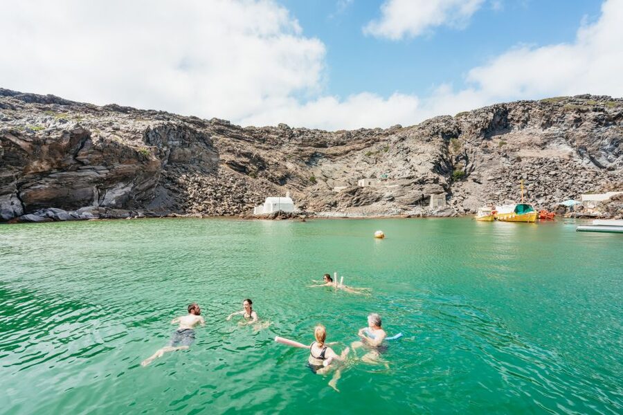 Santorini: Luxury Catamaran Day Trip with Meal and Open Bar - The Oia sunset from offshore