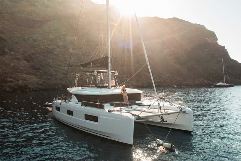 Santorini: Majestic Catamaran Cruise with Meal and Drinks - Sailing out from Ammoudi Bay