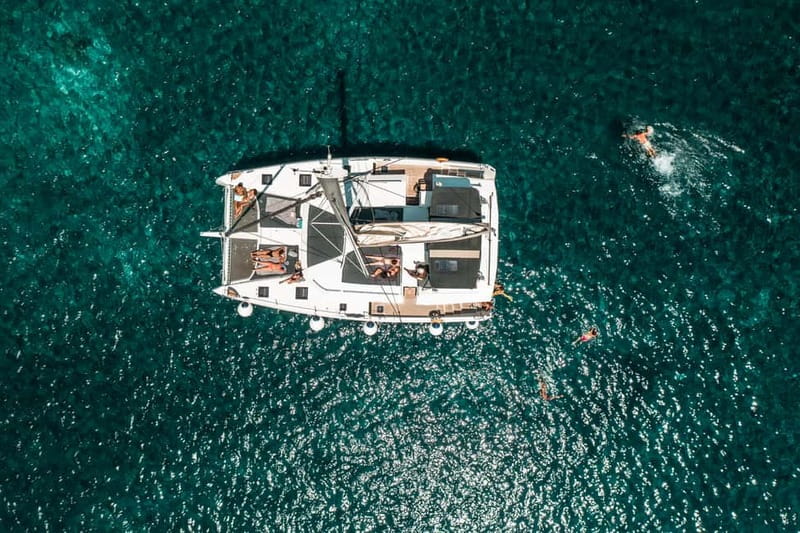 Santorini: Majestic Catamaran Cruise with Meal and Drinks - White Beach and Black Mountain