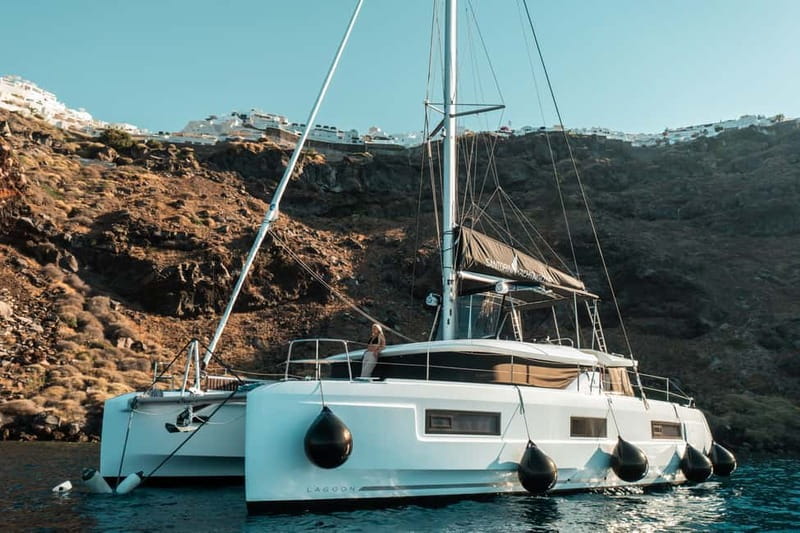 Santorini: Majestic Catamaran Cruise with Meal and Drinks - Red Beach and the volcanic coast