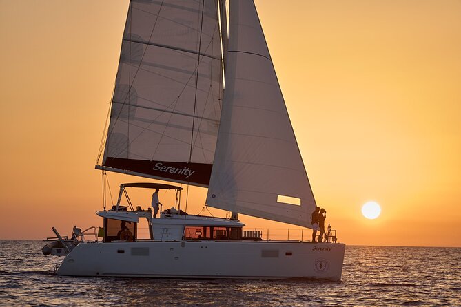 Santorini Oia: Private Sunset Catamaran Cruise with BBQ & Drinks - Lighthouse views and the southern coast