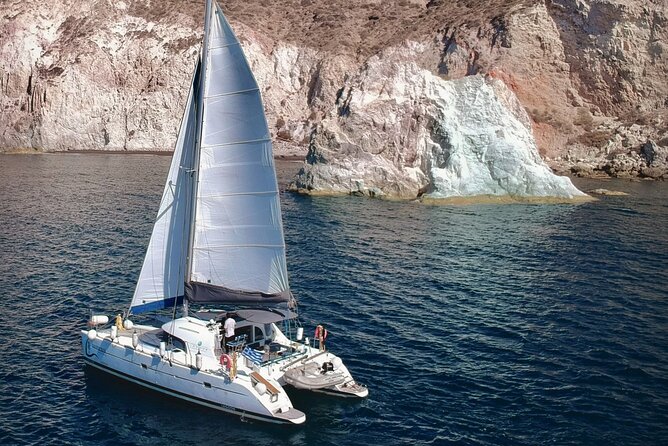 Santorini: Premium Small-Group Catamaran Cruise with Food/Drinks - Red Beach and the first swim