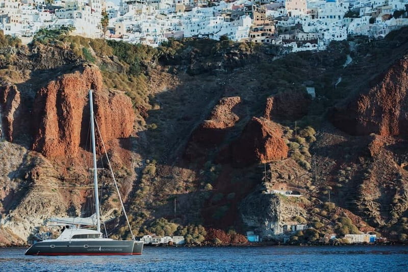 Santorini: Private Catamaran Cruise with BBQ Meal and Drinks - Ammoudi Bay and the first look at the caldera