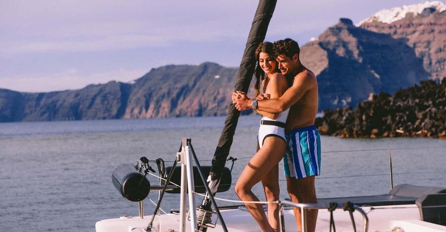 Santorini: Private Catamaran Tour with BBQ Meal and Drinks - Red Beach and the volcanic coast