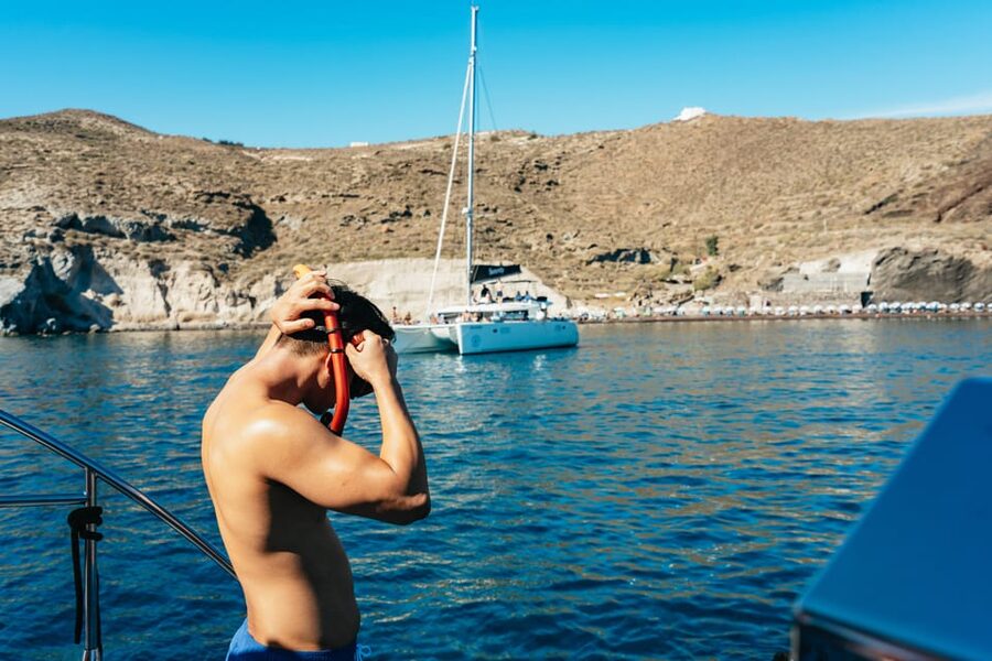 Santorini: Sailing Catamaran Cruise with BBQ and Drinks - Lighthouse views and the caldera