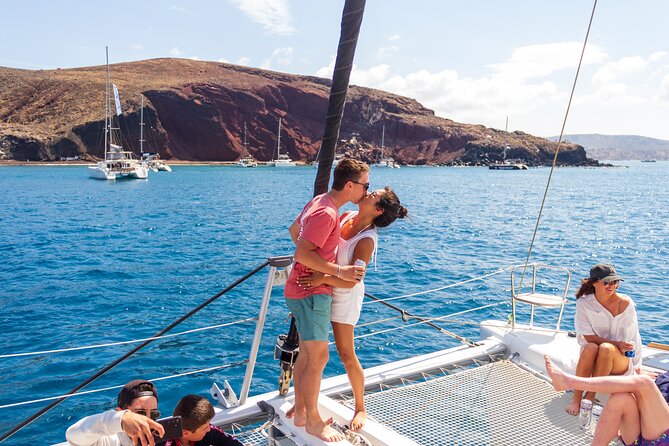 Santorini Sailing Catamaran Daily Cruises w/ Greek BBQ @Thirasia - Red Beach: a short stop with bold colors