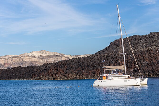Semi Private Santorini Catamaran Tour - White Beach and the pale volcanic cliffs