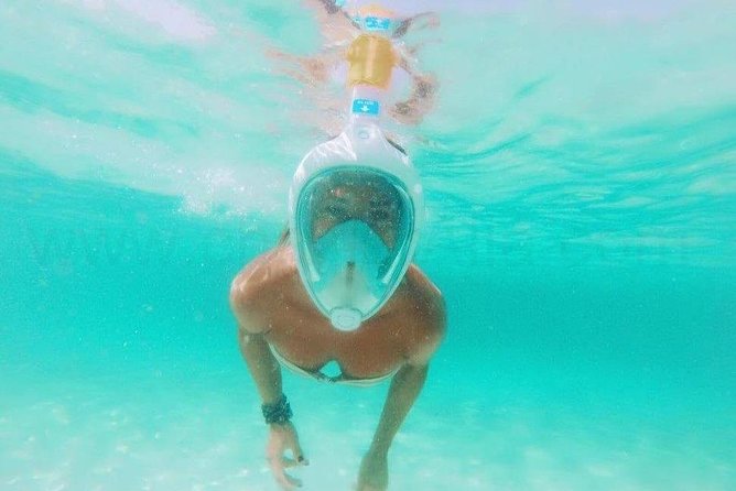 Ses Illetes Beach Formentera Catamaran Private Tour - Swimming, snorkeling, and paddleboarding from the catamaran