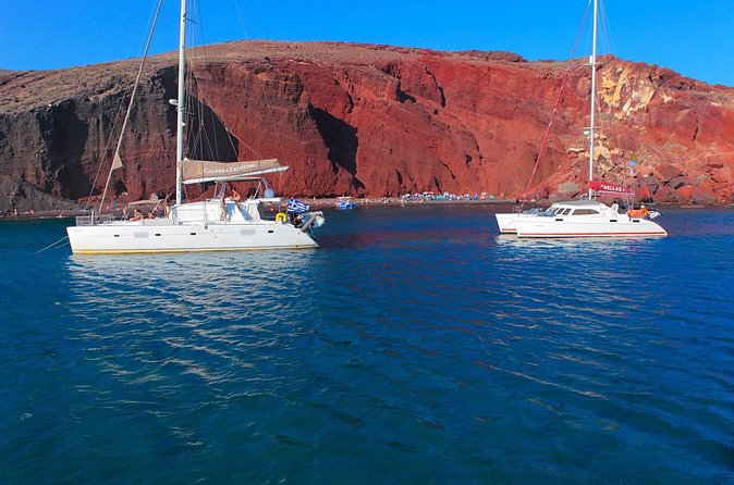 Shared Catamaran Romantic Sunset Cruise from Santorini via Volcano - Greek mezedes, barbecue, and an open bar