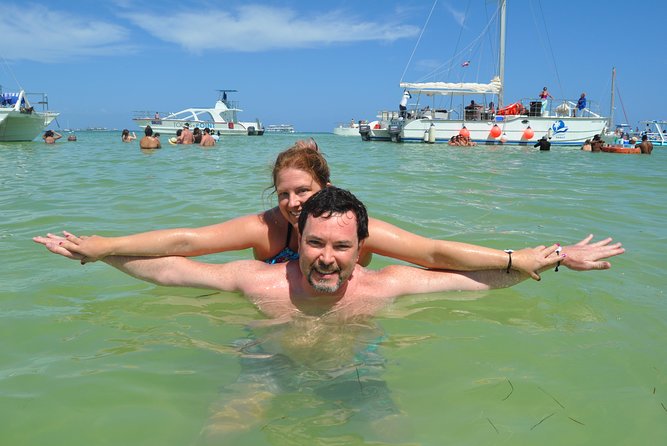 Snorkeling Catamaran Tour & Parasailing - Music, fruit, and the natural pool party