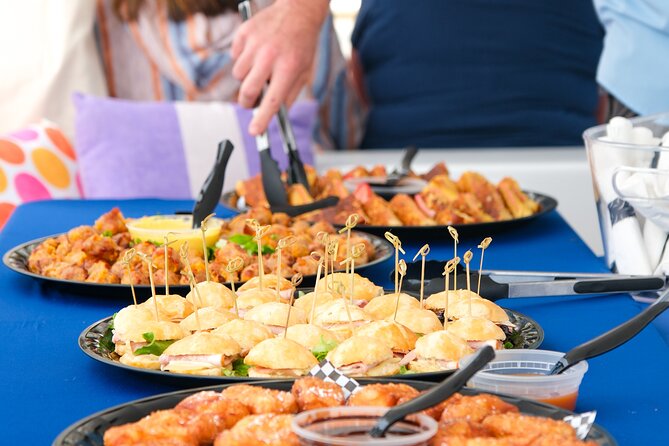 Sunday Mimosa Bar Catamaran Sail with Mini Brunch Bites - USS Yorktown adds scale and naval history