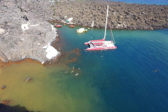 Sunset Sailing Catamaran Cruise in Santorini with BBQ and Drinks - The sunset portion near Oia