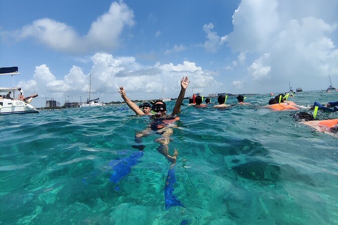 Top Isla Mujeres Catamaran Tour with Snorkel Open Bar and Buffet lunch - Getting from your hotel to the marina