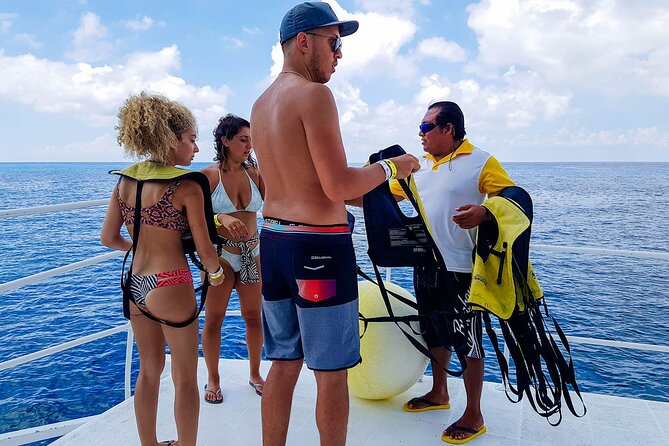 Tour to Cozumel by Catamaran with Snorkeling and Buffet Lunch - Boarding the catamaran for the reef stops